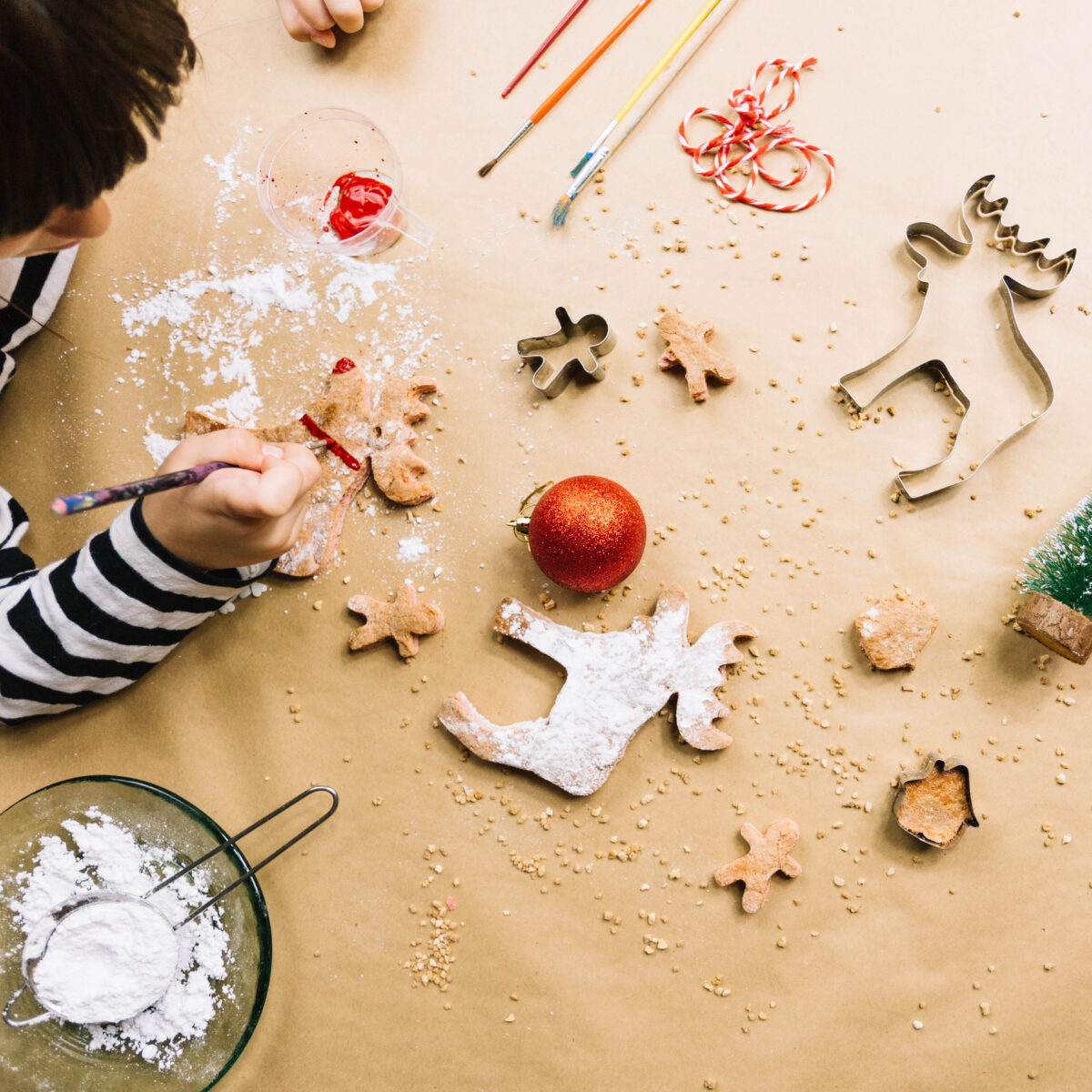 top-view-kid-making-christmas-cookies