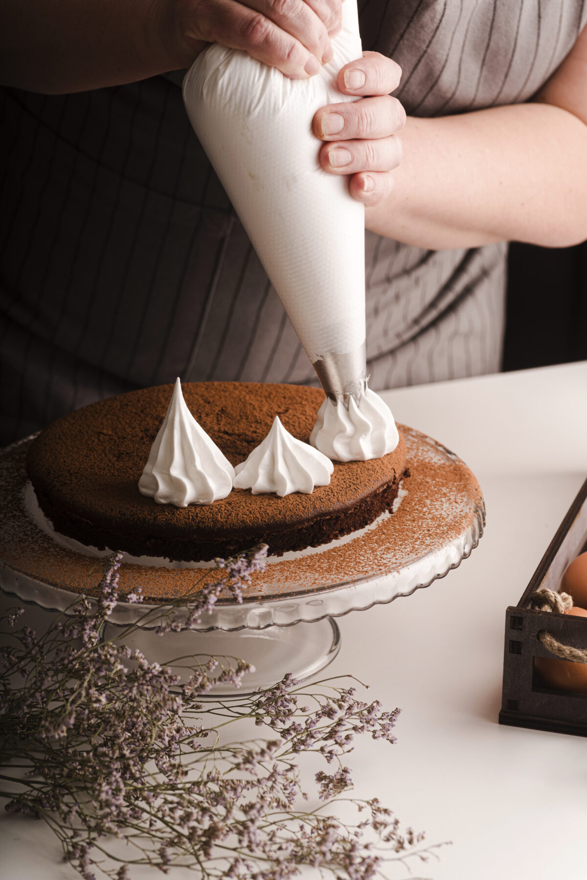 cook-putting-icing-decorations-cake